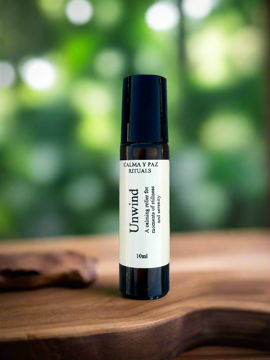 Small black and white bottle on a textured gray surface